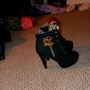 Black high lace up heels with leopard interior and gold accents